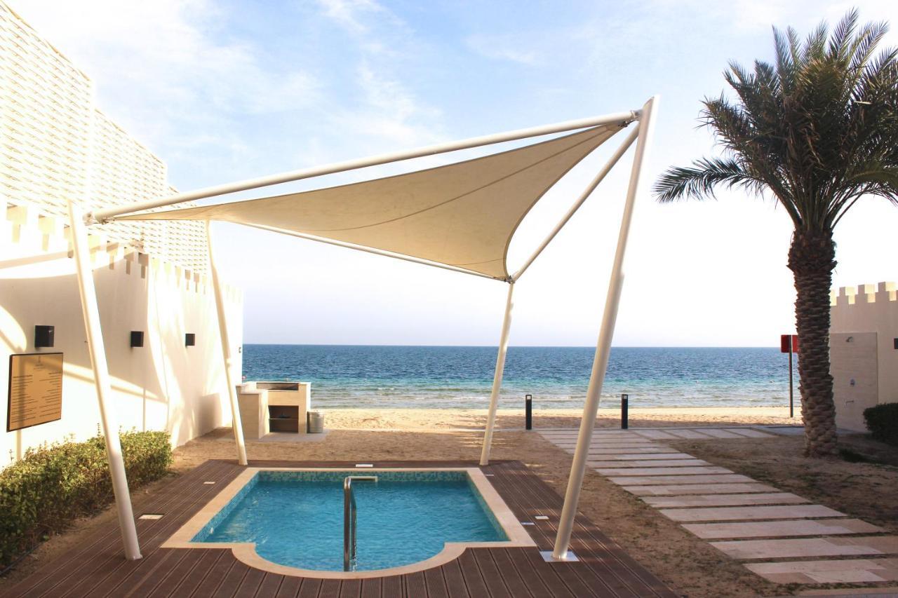 Sealine Beach, A Murwab Resort Mesaieed Exterior foto A shade sail over a swimming pool